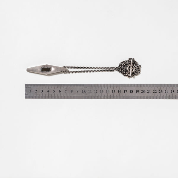 Sterling silver rhombus talisman necklace with verdelite pendant shown with ruler for size reference