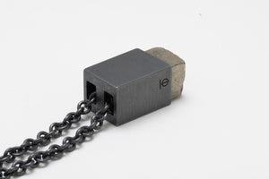 Matte black pyrite pendant angled side view